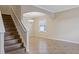 Open concept living space features decorative tile flooring, neutral paint and staircase to upper level at 10808 Whitecap Dr, Riverview, FL 33579