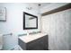 Chic bathroom with a modern vanity and stylish pendant lights at 11071 141St St, Largo, FL 33774