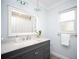 Modern bathroom with a large vanity, a big mirror, and modern fixtures at 11071 141St St, Largo, FL 33774