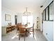 Inviting dining room features a round table, elegant lighting, and neutral decor at 11071 141St St, Largo, FL 33774
