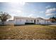 Charming single story home with an attached garage and a white picket fence at 11071 141St St, Largo, FL 33774