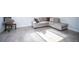 Comfortable living room with a cozy gray sectional and lots of natural light at 11071 141St St, Largo, FL 33774