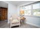 Cozy sitting area with natural light streaming through the window, complemented by modern furnishings at 11071 141St St, Largo, FL 33774
