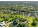 An aerial view shows the property's location on a wooded lot near the river at 11109 Winn Rd, Riverview, FL 33569