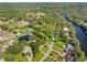 An aerial view of the property shows the home on a large lot, near the river at 11109 Winn Rd, Riverview, FL 33569