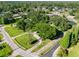 House with lush trees surrounded by a well maintained yard in a suburban setting at 11109 Winn Rd, Riverview, FL 33569