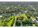 Aerial view of home showcasing spacious lot, mature trees, and proximity to waterways at 11109 Winn Rd, Riverview, FL 33569