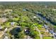 Aerial view of property showing the house, pond and surrounding neighborhood at 11109 Winn Rd, Riverview, FL 33569