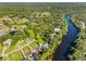 Beautiful aerial view of a waterfront property with lush greenery and a winding river at 11109 Winn Rd, Riverview, FL 33569