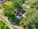Aerial view of house surrounded by lush trees, showcasing its privacy and natural setting at 11109 Winn Rd, Riverview, FL 33569
