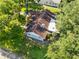 Charming single-Gathering home featuring a neatly maintained roof and surrounded by lush greenery and mature trees at 11109 Winn Rd, Riverview, FL 33569