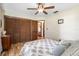 This cozy bedroom features hardwood floors, a comfy bed, natural light, and ample closet space at 11109 Winn Rd, Riverview, FL 33569