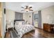This cozy bedroom features hardwood floors, a comfy bed, natural light, and ample closet space at 11109 Winn Rd, Riverview, FL 33569