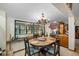 Charming dining area with a decorative chandelier and views of the backyard at 11109 Winn Rd, Riverview, FL 33569