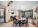 Elegant dining area featuring a chandelier and a large window providing natural light at 11109 Winn Rd, Riverview, FL 33569