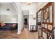 Inviting foyer with wood floors, coat rack, and views into the living room at 11109 Winn Rd, Riverview, FL 33569