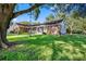 Charming single story home featuring stone accents, a cozy front porch, and well-manicured lawn at 11109 Winn Rd, Riverview, FL 33569
