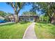 Charming single story home featuring stone accents, a cozy front porch, and well-manicured lawn at 11109 Winn Rd, Riverview, FL 33569