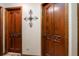 Hallway with hardwood floors and vintage wooden doors at 11109 Winn Rd, Riverview, FL 33569