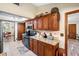 Kitchen boasting granite countertops, wood cabinets, and a connected dining area at 11109 Winn Rd, Riverview, FL 33569