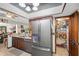 Well-equipped kitchen with stainless steel refrigerator, ample counter space, and a walk-in pantry at 11109 Winn Rd, Riverview, FL 33569