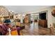 Cozy living room with wood floors, fireplace, and access to dining area at 11109 Winn Rd, Riverview, FL 33569