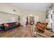 Open living room with vaulted ceilings, wood floors, and an arched entryway at 11109 Winn Rd, Riverview, FL 33569