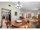 Open-concept living space connecting dining room and sitting area at 11109 Winn Rd, Riverview, FL 33569