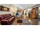 Spacious living room showcasing wood floors and open layout to kitchen at 11109 Winn Rd, Riverview, FL 33569