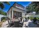Backyard featuring a brick patio with outdoor seating, a grill, and a well-maintained lawn at 112 W Sligh Ave, Tampa, FL 33604