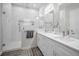 Modern bathroom featuring a glass enclosed shower and double sink vanity at 112 W Sligh Ave, Tampa, FL 33604