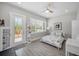 Bright bedroom with large window, stylish door, and decorative shelving at 112 W Sligh Ave, Tampa, FL 33604