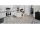 Spacious kitchen with stainless steel appliances, a large island, and granite countertops at 112 W Sligh Ave, Tampa, FL 33604