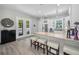 Kitchen featuring stainless appliances, white cabinets, granite countertop island, and bar stool seating at 112 W Sligh Ave, Tampa, FL 33604