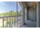 Spacious balcony with screened windows and scenic view at 13025 Sanctuary Cove Dr # 301, Temple Terrace, FL 33637