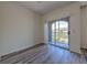 Cozy bedroom features sliding door to a private balcony at 13025 Sanctuary Cove Dr # 301, Temple Terrace, FL 33637
