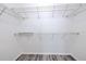Walk-in closet featuring wire shelving and gray wood-look flooring at 13025 Sanctuary Cove Dr # 301, Temple Terrace, FL 33637
