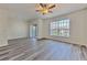 Open concept living room with ceiling fan, large window allowing abundant natural light at 13025 Sanctuary Cove Dr # 301, Temple Terrace, FL 33637