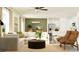 Inviting living room showcases stylish furniture, natural light, and seamless open-concept design with kitchen at 13138 Empress Jewel Trl, Parrish, FL 34219