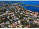 Stunning aerial view of the neighborhood with waterfront access and lush greenery at 132 Giralda Ne Blvd, St Petersburg, FL 33704