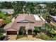 Beautiful home exterior with a manicured lawn, paver driveway, and mature landscaping at 132 Giralda Ne Blvd, St Petersburg, FL 33704