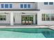 Backyard featuring a covered patio, pool, and manicured lawn at 13859 Sharp Hawk Dr, Riverview, FL 33569