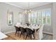 Light-filled dining area features modern decor, plantation shutters, and beautiful mirrors at 13859 Sharp Hawk Dr, Riverview, FL 33569
