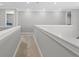 Upstairs hallway with a neutral color palette and carpet flooring at 13859 Sharp Hawk Dr, Riverview, FL 33569