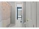 Inviting hallway leads to a bedroom and bathroom, blending style and functionality at 13859 Sharp Hawk Dr, Riverview, FL 33569
