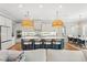 Gorgeous kitchen features a large island, pendant lighting, and modern appliances, perfect for culinary enthusiasts at 13859 Sharp Hawk Dr, Riverview, FL 33569