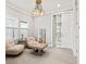 Inviting sitting room features neutral tones, modern lighting, and a comfortable seating area at 13859 Sharp Hawk Dr, Riverview, FL 33569
