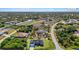 Aerial view of a community showcasing the single Gathering homes, lush greenery, and waterways at 14024 Wenzel Ave, Port Charlotte, FL 33981