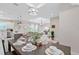 Formal dining area open to the living room and kitchen, with modern light fixtures at 14024 Wenzel Ave, Port Charlotte, FL 33981
