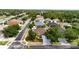 Aerial view of homes with lush trees and manicured lawns, showcasing a peaceful suburban environment at 14027 Bensbrook Dr, Spring Hill, FL 34609